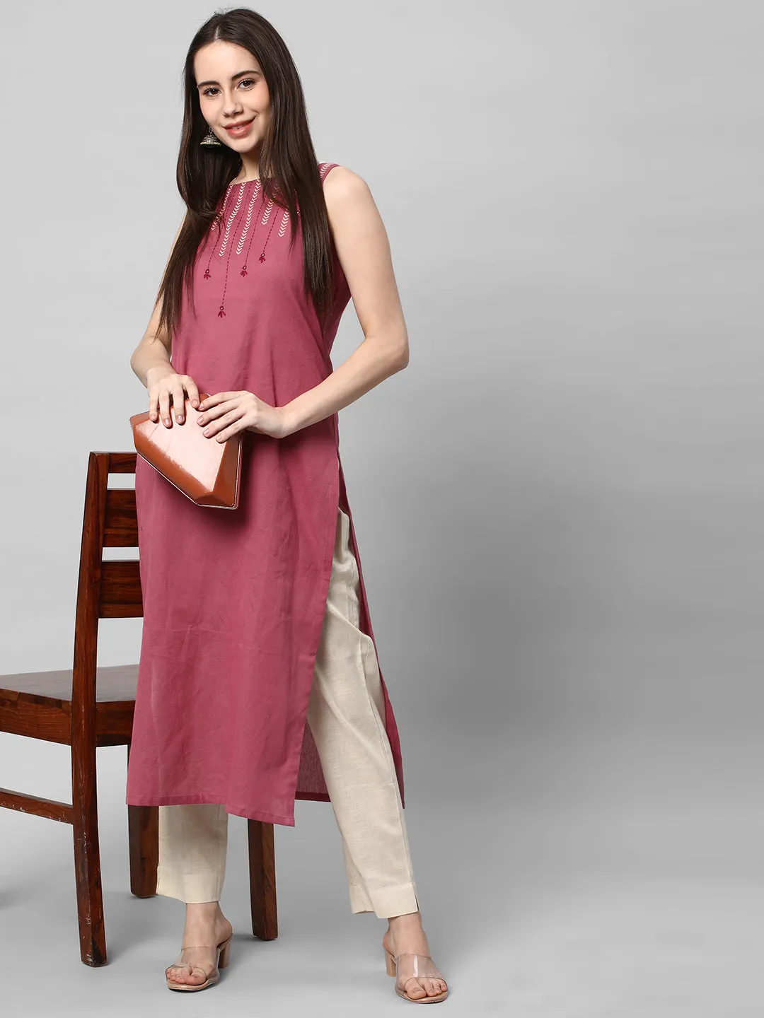 A Cream ankle length cotton linen pant with plain belt in front.