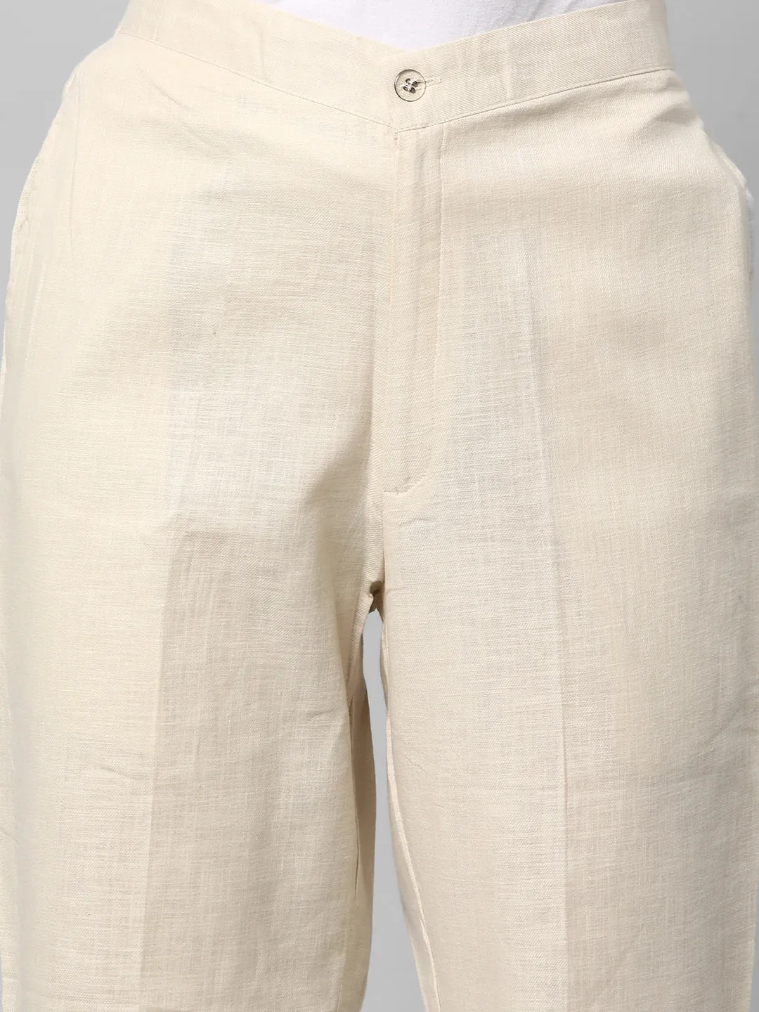 A Cream ankle length cotton linen pant with plain belt in front.